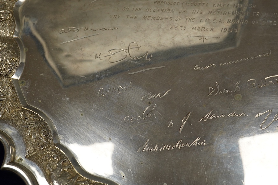 A mid 20th century Indian white metal (stamped sterling silver) presentation salver, engraved with numerous signatures, diameter 35.6cm, 36.8oz, with box.